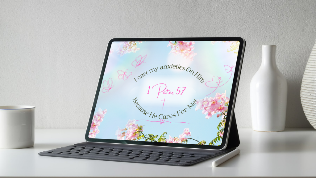 Tablet on a stand showing the 1 Peter 5:7 Christian wallpaper with its floral design