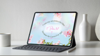 Tablet on a stand showing the 1 Peter 5:7 Christian wallpaper with its floral design